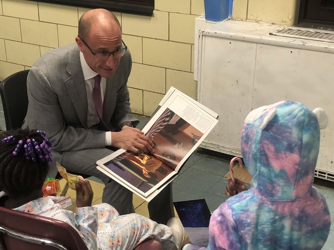 Top-Rated Personal Injury Attorney in Maryland, Paul D'Amore reading to children