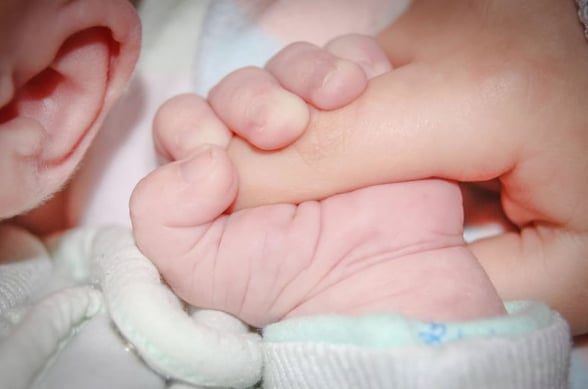 Infant Holding Finger