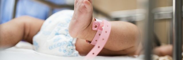 baby in a hospital crib